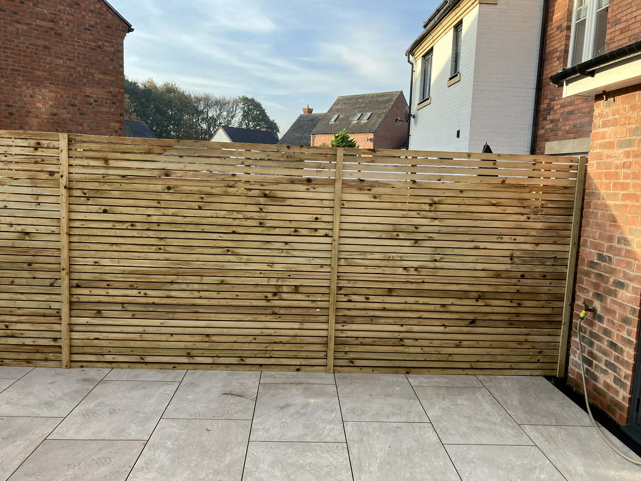 Contemporary slatted timber fencing