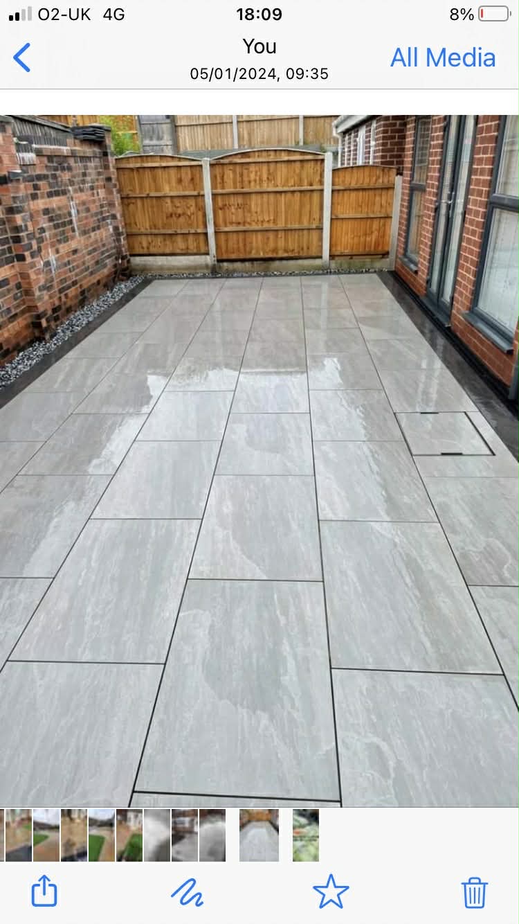 Large porcelain patio with gravel borders