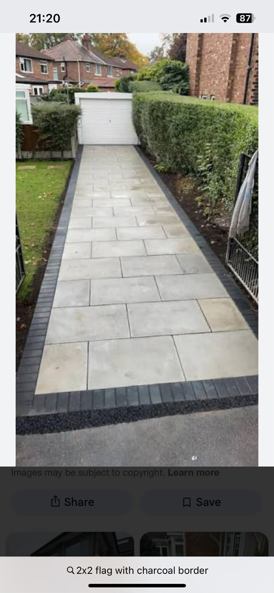 Concrete flagging driveway with charcoal block border