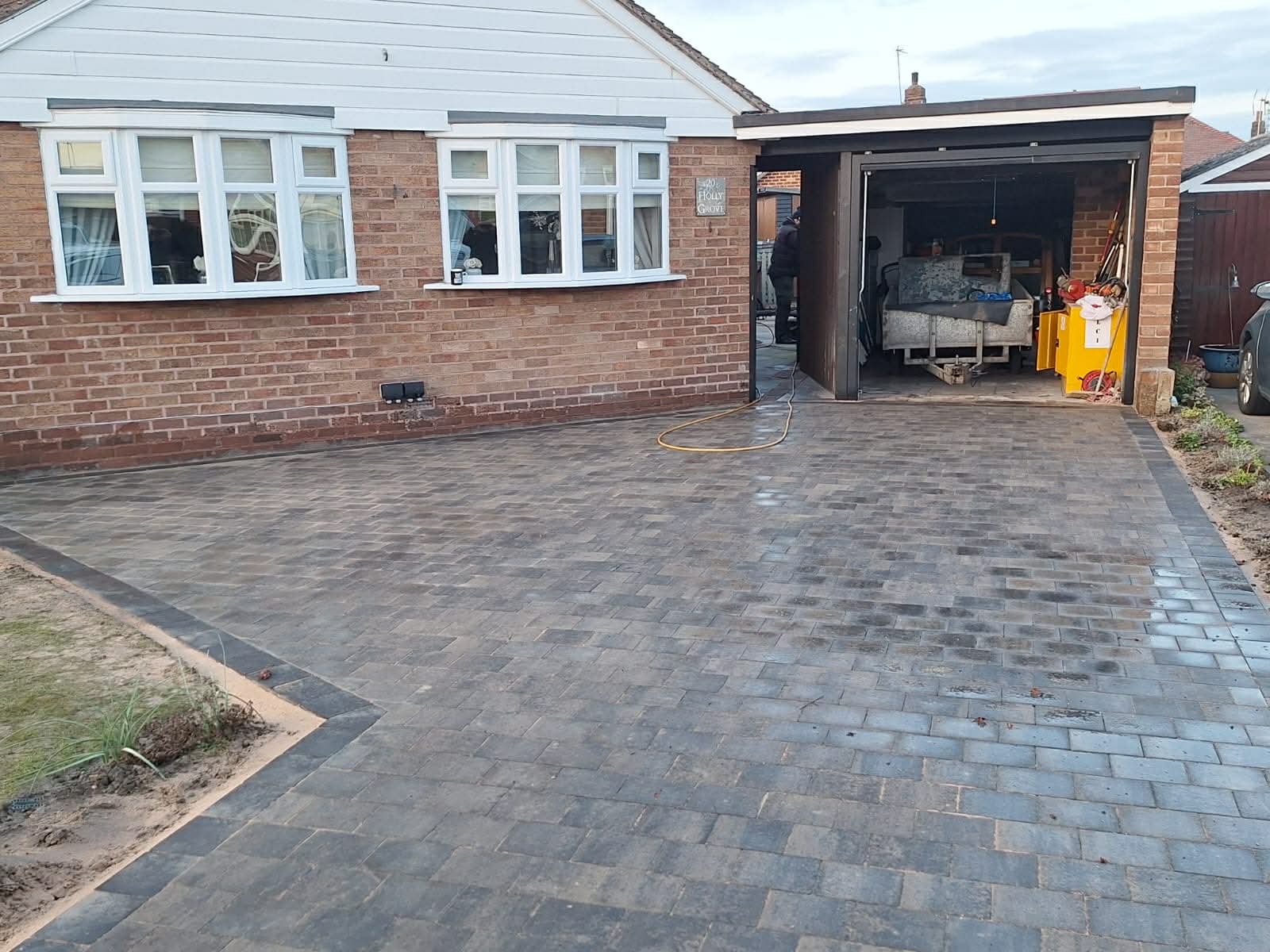 Large block paving driveway with charcoal border